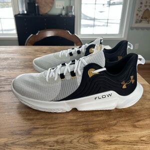 Under Armour Men's White and Black Athletic Shoes with Gold Accents